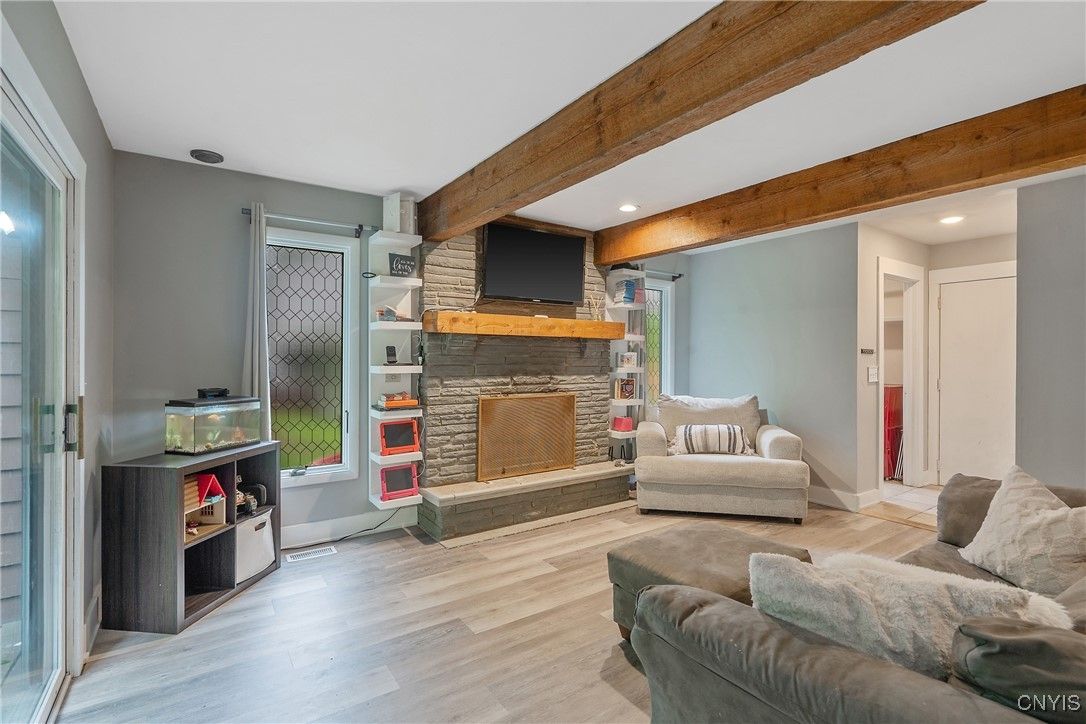 Fireplace, Interior, Living room, Recessed Lighting, Stone Walls, Wooden Beams, Wood Texture Flooring