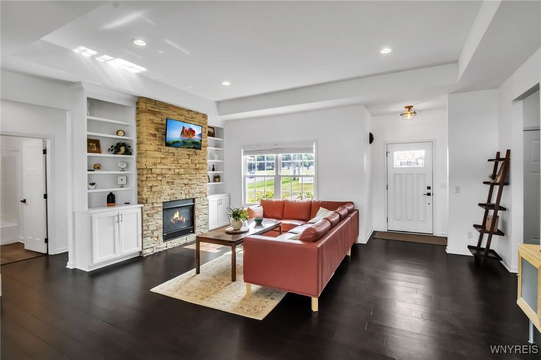 Fireplace, Interior, Living room, Recessed Lighting, Stone Walls, Wood Texture Flooring