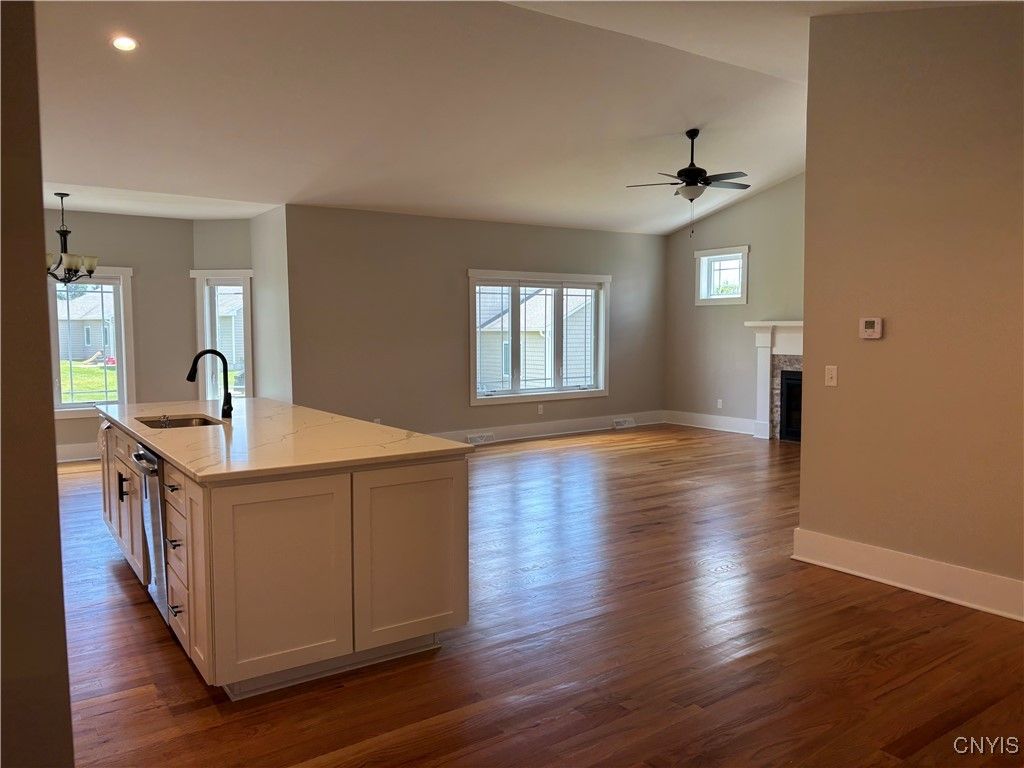Empty room, Fireplace, Interior, Kitchen, Recessed Lighting, Wood Texture Flooring
