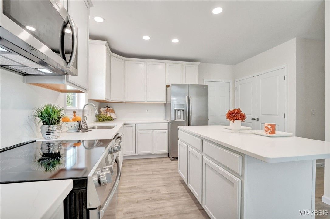Interior, Kitchen, Recessed Lighting, Stainless Steel Appliances, Washer, Wood Texture Flooring