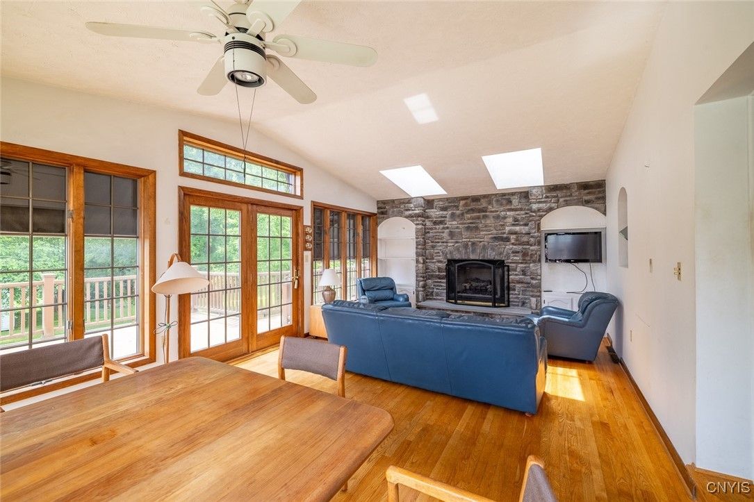 Dining room, Fireplace, Interior, Living room, Stone Walls, Wood Texture Flooring