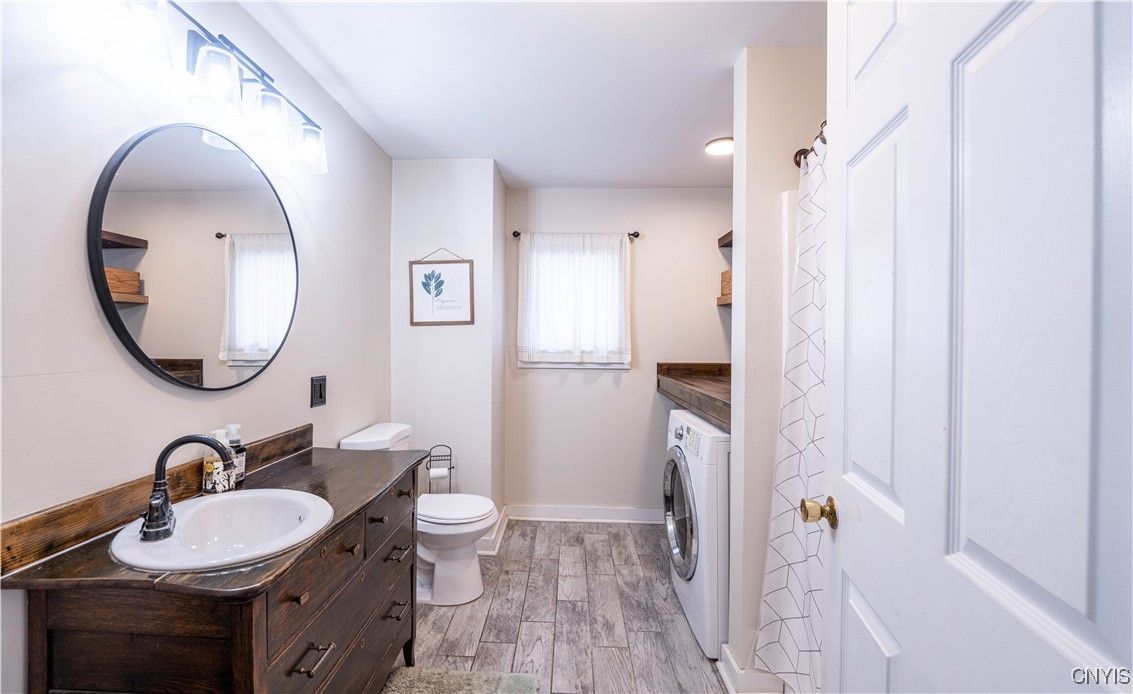 Bathroom, Dual Sink Vanities, Interior, Recessed Lighting, Washer, Wood Texture Flooring