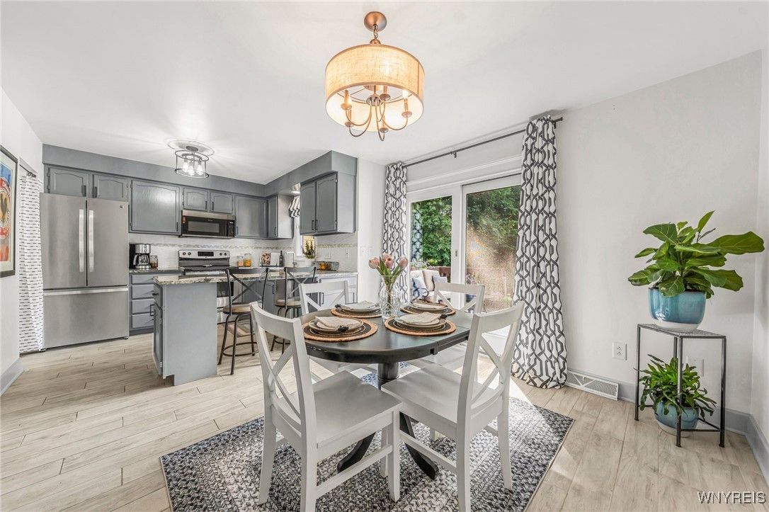 Chandelier, Dining room, Interior, Kitchen, Stainless Steel Appliances, Wood Texture Flooring