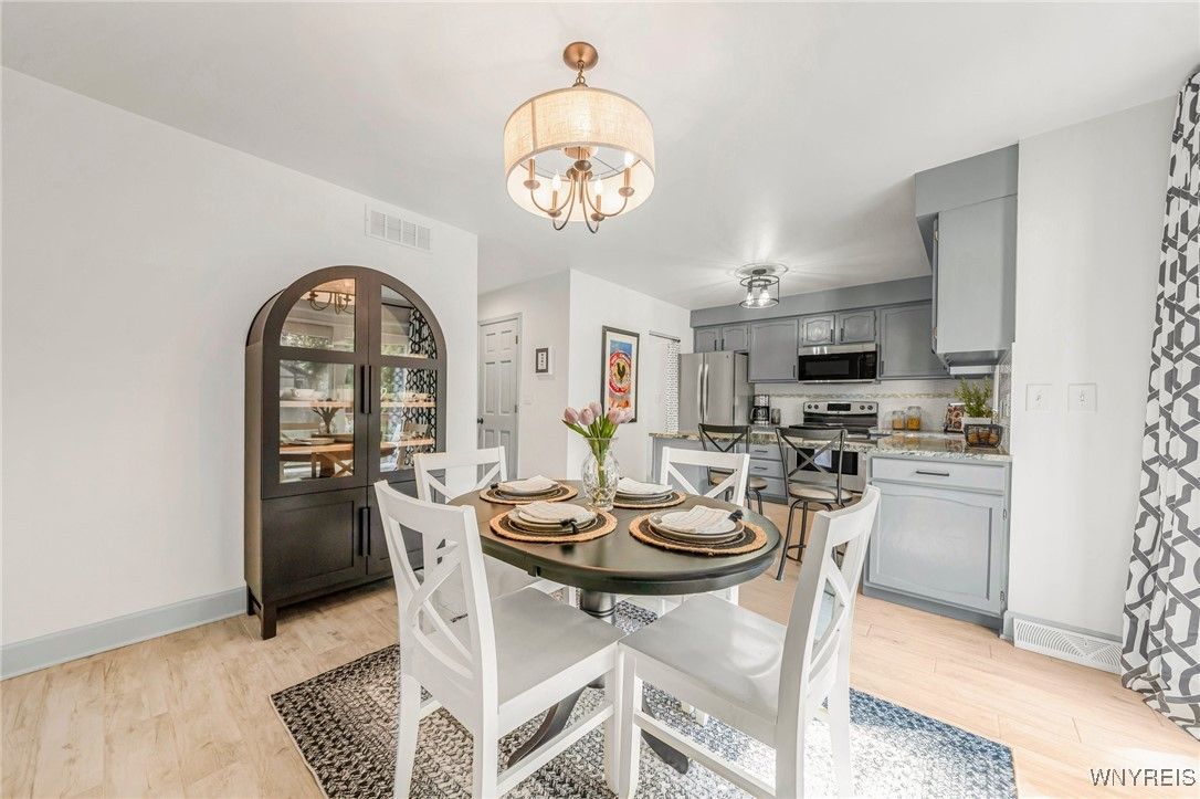 Chandelier, Dining room, Interior, Kitchen, Stainless Steel Appliances, Wood Texture Flooring