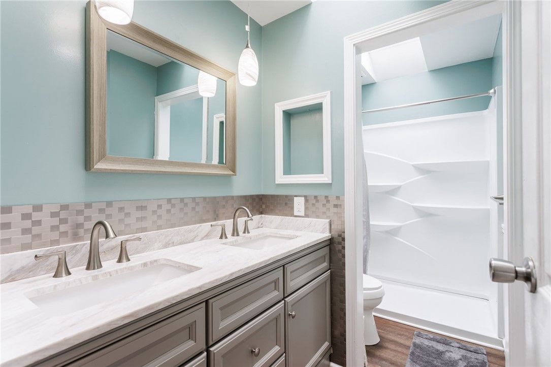 Bathroom, Dual Sink Vanities, Interior, Pendant Lights, Wood Texture Flooring