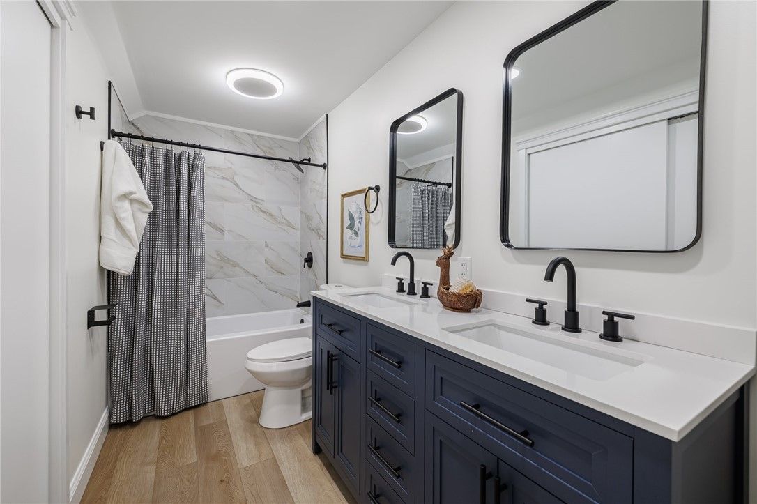 Bathroom, Dual Sink Vanities, Interior, Marble Walls, Wood Texture Flooring
