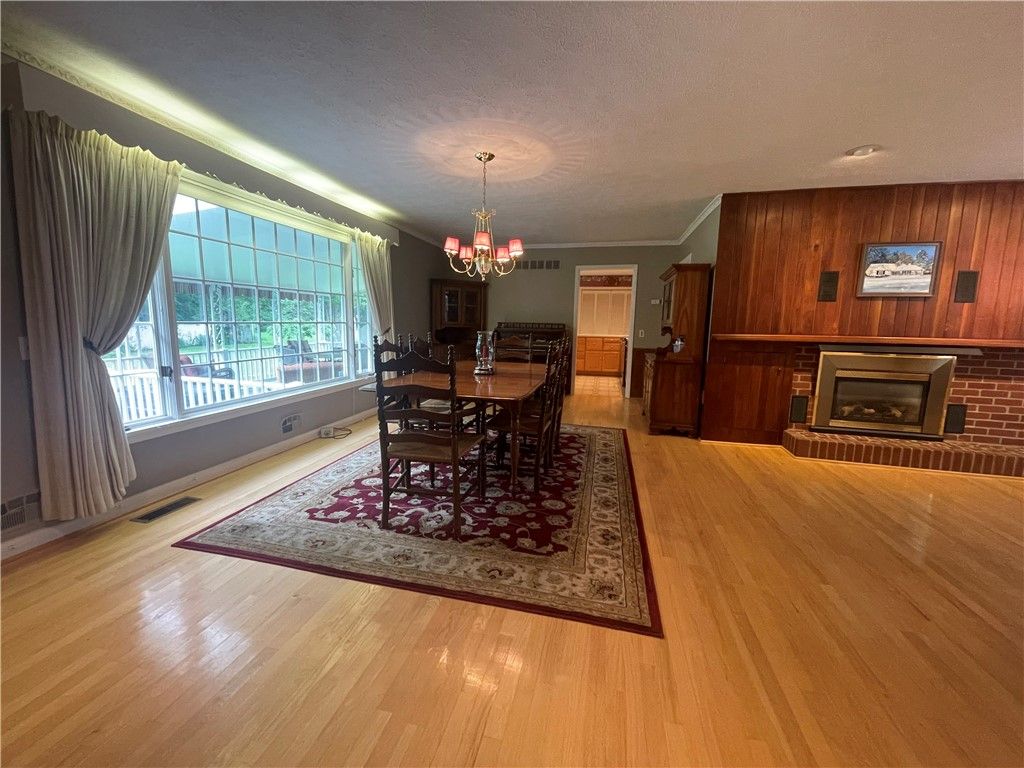 Chandelier, Dining room, Fireplace, Interior, Wood Texture Flooring, Wooden Walls
