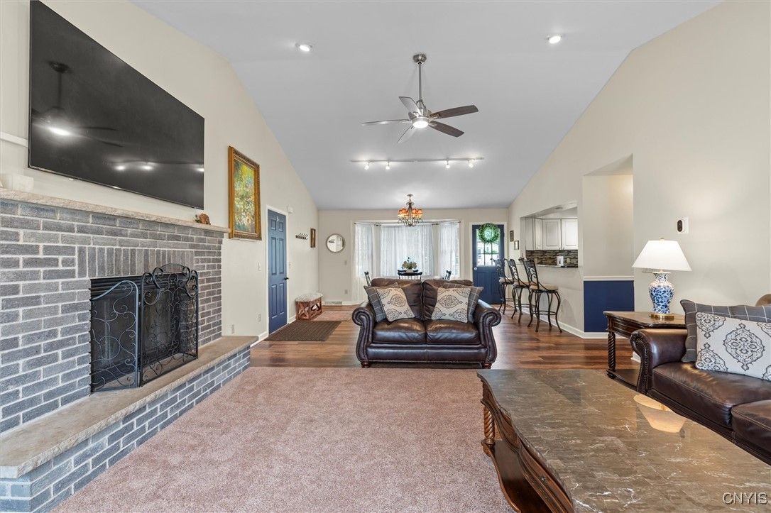 Dining room, Fireplace, Interior, Recessed Lighting, Stone Walls, Wood Texture Flooring