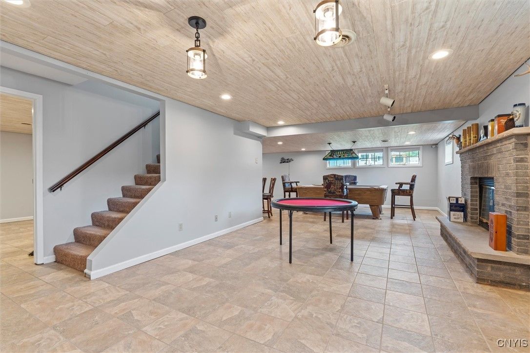 Billiard Table, Fireplace, Game Room, Interior, Pendant Lights, Recessed Lighting, Stone Walls, Wooden Ceilings