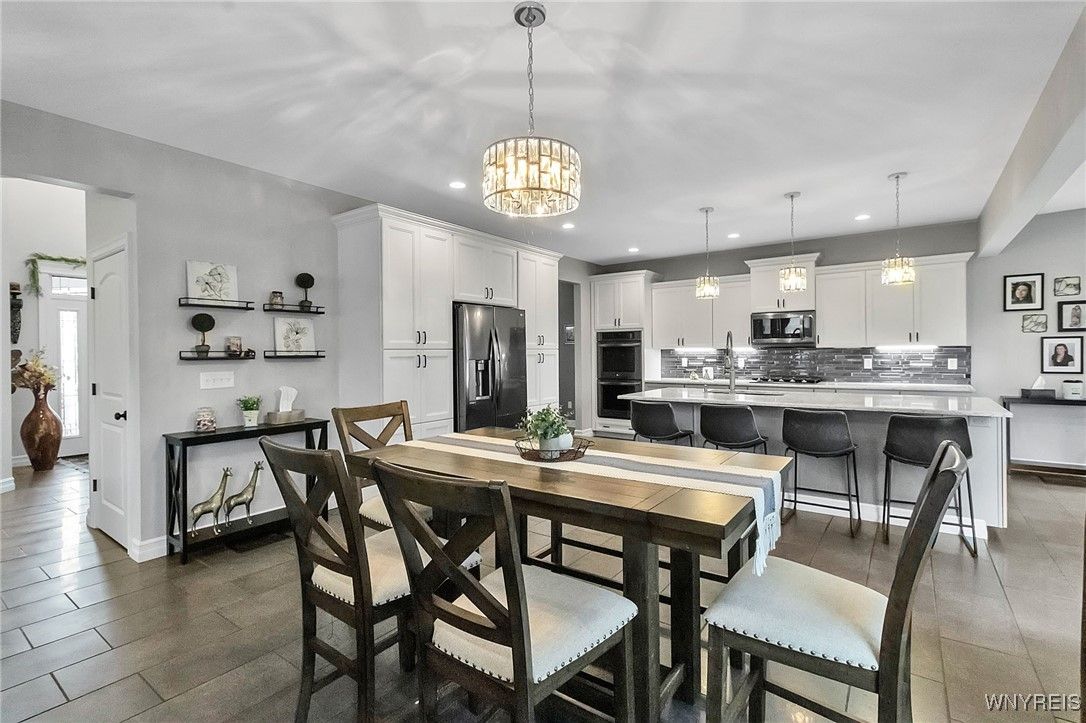 Dining room, Interior, Kitchen, Pendant Lights, Recessed Lighting, Stainless Steel Appliances, Wood Texture Flooring
