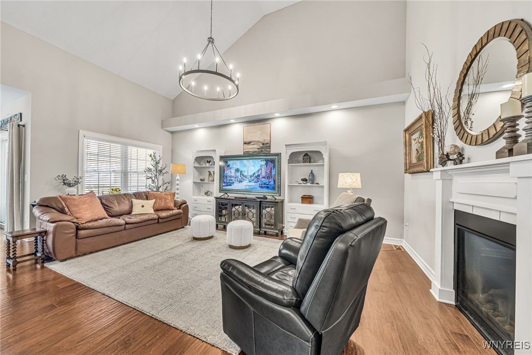Chandelier, Fireplace, Interior, Living room, Recessed Lighting, Wood Texture Flooring