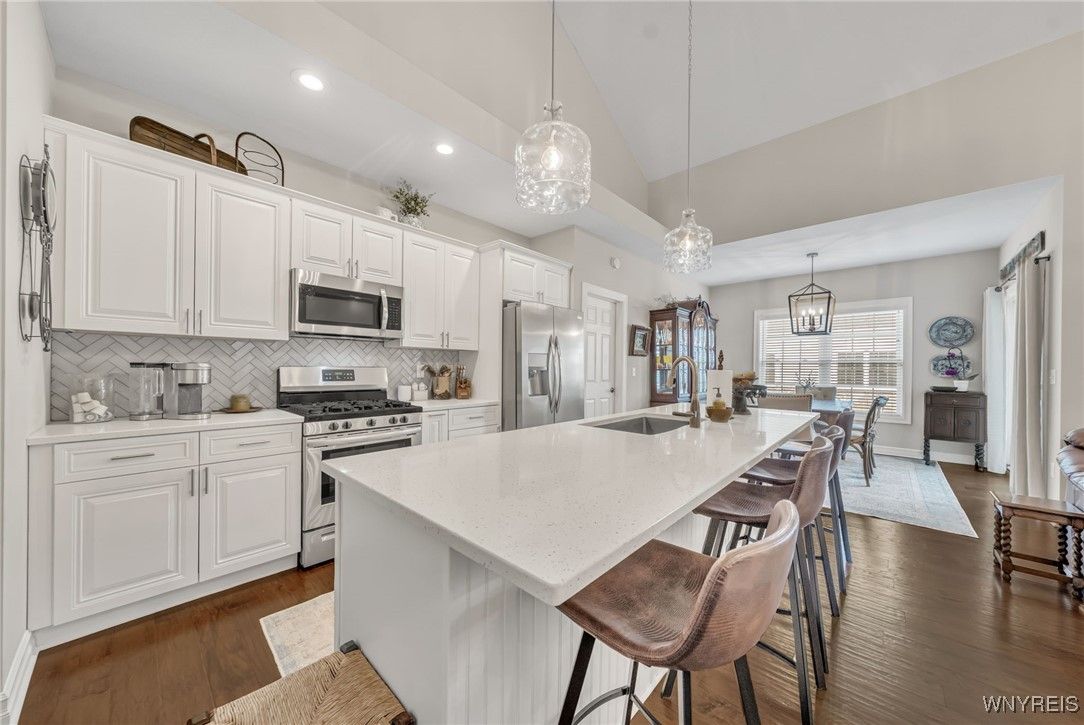 Dining room, Interior, Kitchen, Pendant Lights, Recessed Lighting, Stainless Steel Appliances, Wood Texture Flooring