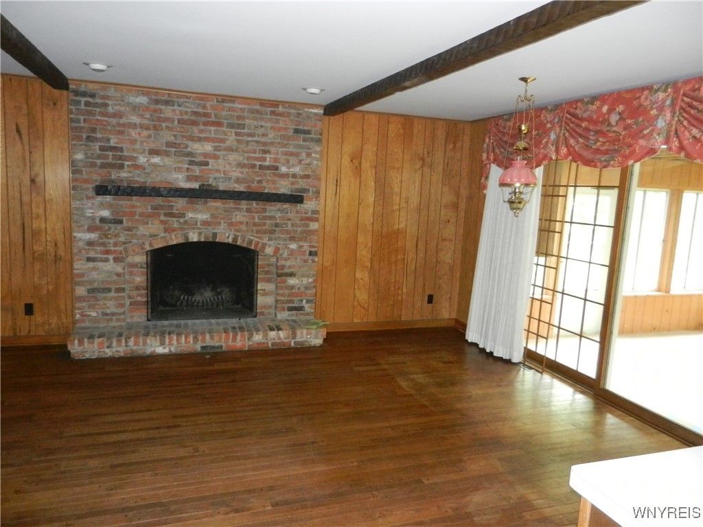 Chandelier, Empty room, Fireplace, Interior, Recessed Lighting, Stone Walls, Wooden Beams, Wood Texture Flooring
