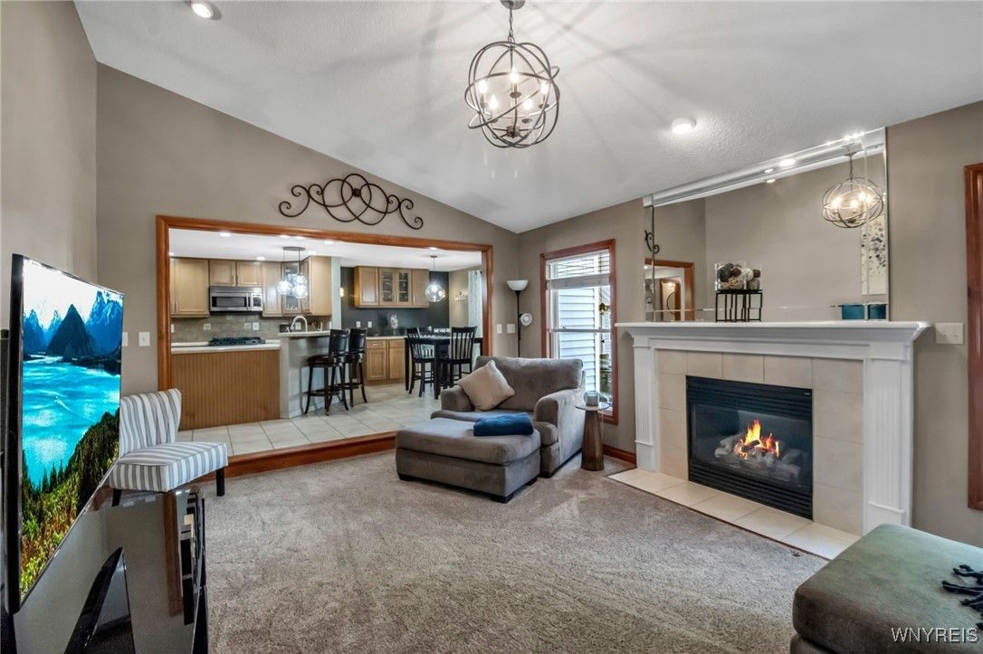 Chandelier, Fireplace, Interior, Kitchen, Living room, Pendant Lights, Recessed Lighting, Stainless Steel Appliances