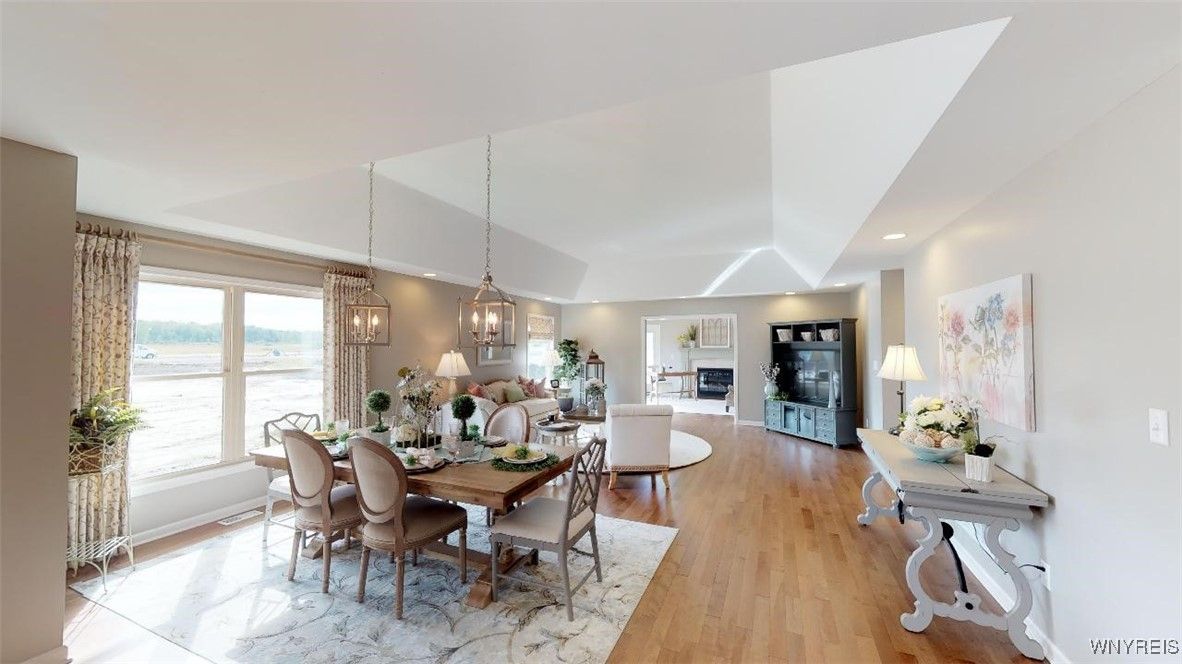 Dining room, Fireplace, Interior, Living room, Pendant Lights, Recessed Lighting, Water, Wood Texture Flooring