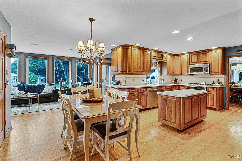 Chandelier, Dining room, Interior, Kitchen, Living room, Recessed Lighting, Wood Texture Flooring