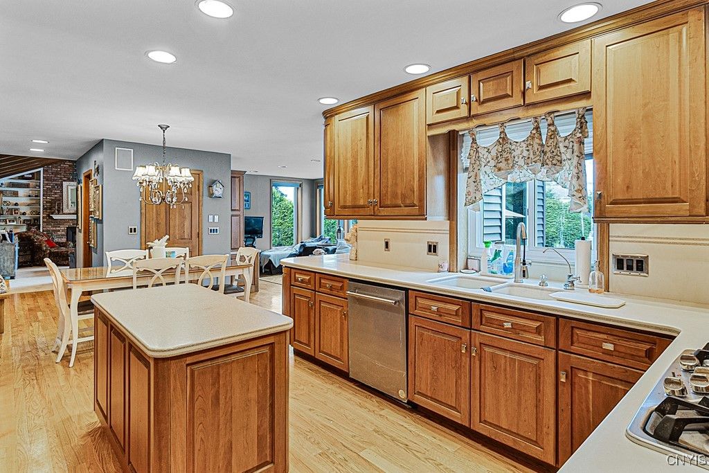 Chandelier, Dining room, Interior, Kitchen, Recessed Lighting, Stone Walls, Wood Texture Flooring