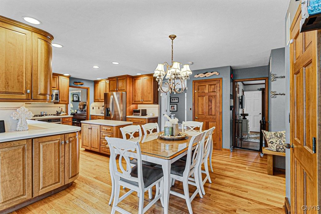 Chandelier, Dining room, Interior, Kitchen, Recessed Lighting, Stainless Steel Appliances, Wood Texture Flooring