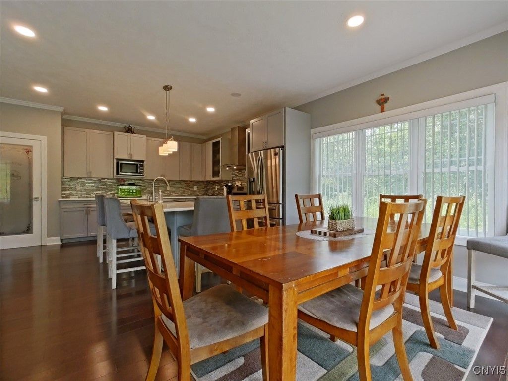 Dining room, Interior, Kitchen, Pendant Lights, Recessed Lighting, Stainless Steel Appliances, Wood Texture Flooring