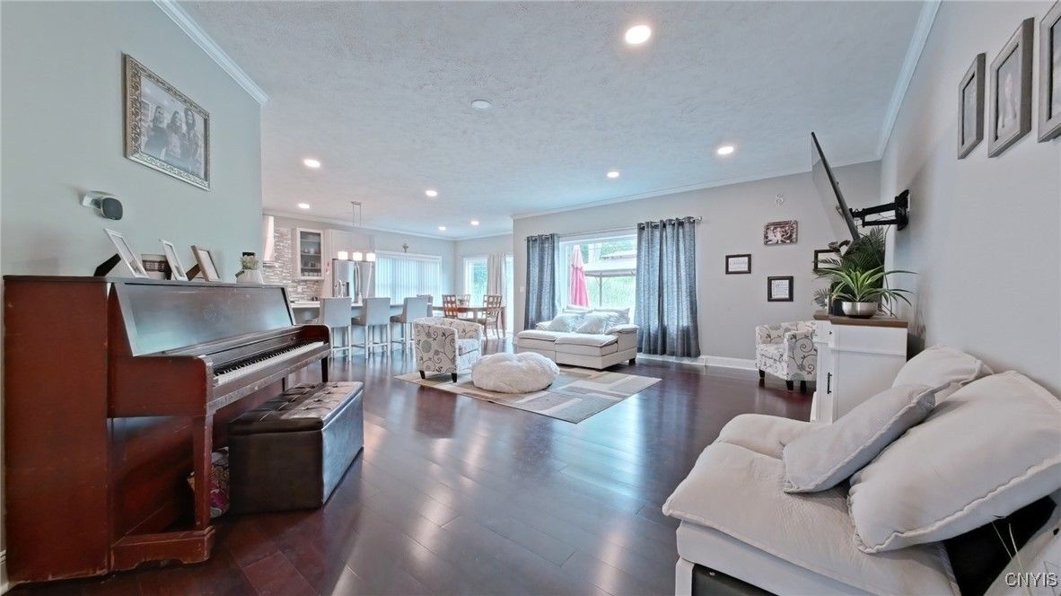 Dining room, Fireplace, Interior, Living room, Pendant Lights, Piano, Recessed Lighting, Wood Texture Flooring