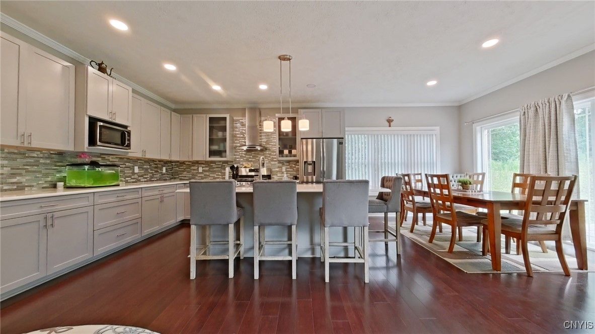 Dining room, Interior, Kitchen, Pendant Lights, Recessed Lighting, Stainless Steel Appliances, Wood Texture Flooring