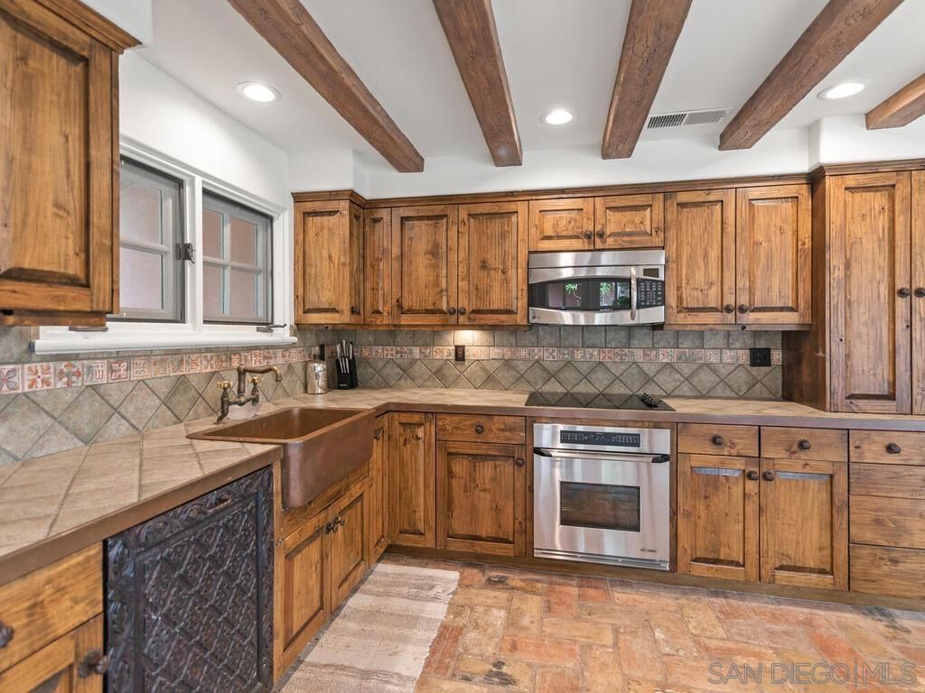 Interior, Kitchen, Recessed Lighting, Stainless Steel Appliances, Tile Countertops, Wooden Beams