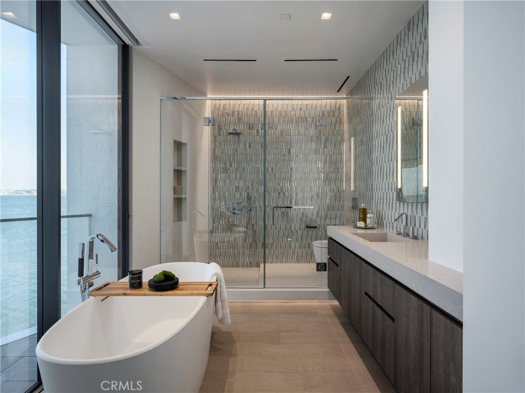 Bathroom, Dual Sink Vanities, Free Standing Baths, Glass Shower, Interior, Recessed Lighting, Water, Wood Texture Flooring