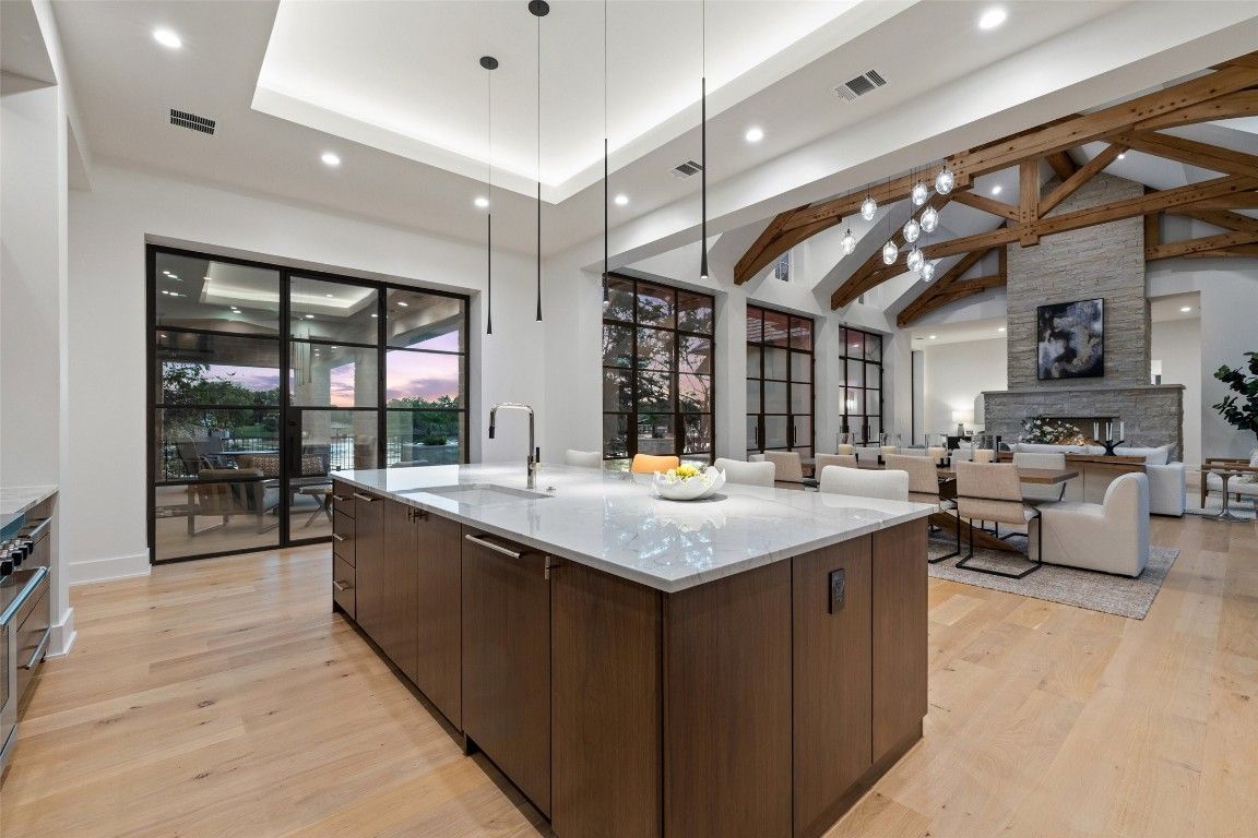 Dining room, Fireplace, Interior, Kitchen, Living room, Pendant Lights, Recessed Lighting, Stone Walls, Wooden Beams, Wood Texture Flooring