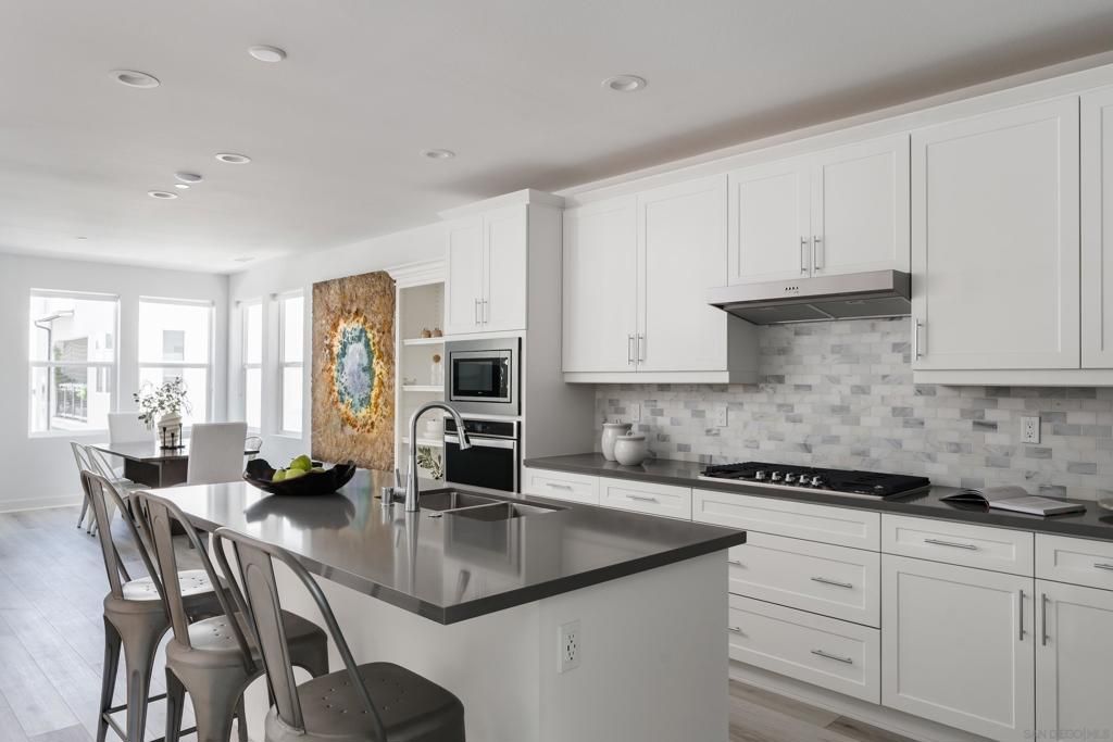 Dining room, Interior, Kitchen, Recessed Lighting, Stainless Steel Appliances, Wood Texture Flooring