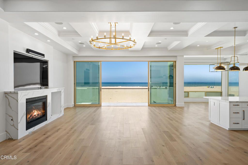 Chandelier, Fireplace, Interior, Pendant Lights, Recessed Lighting, Water, Wood Texture Flooring