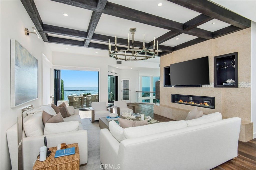 Chandelier, Fireplace, Interior, Living room, Recessed Lighting, Water, Wooden Beams, Wood Texture Flooring