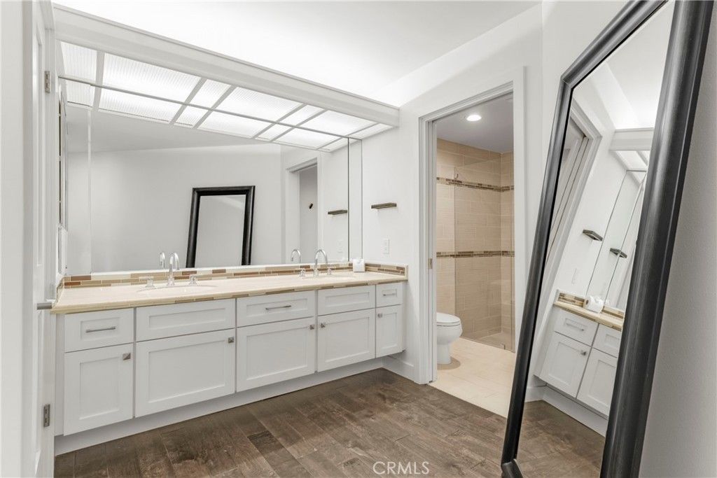 Bathroom, Dual Sink Vanities, Glass Shower, Interior, Recessed Lighting, Wood Texture Flooring