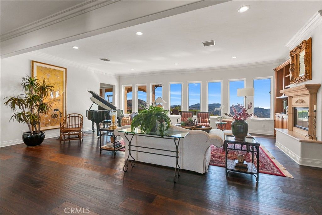 Fireplace, Interior, Living room, Piano, Recessed Lighting, Wood Texture Flooring