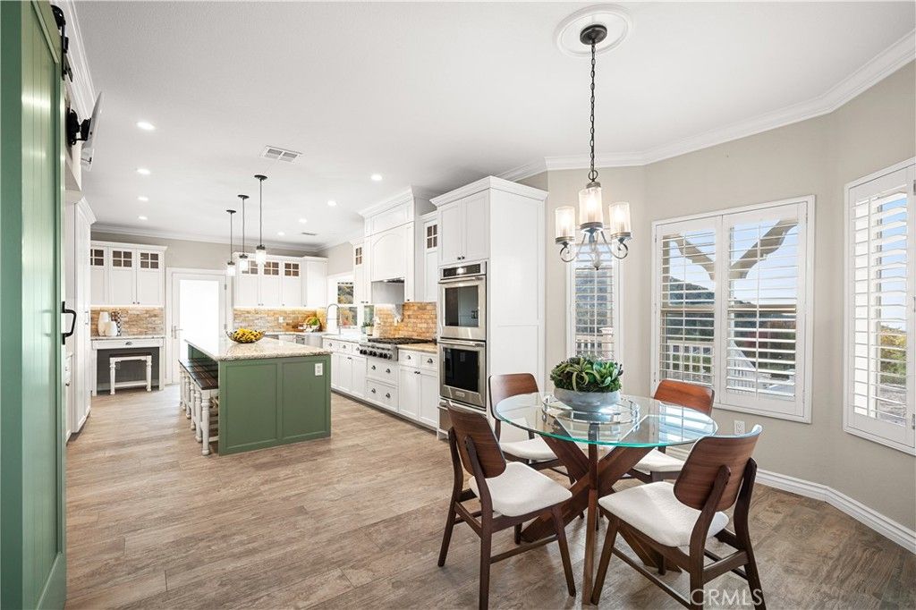 Dining room, Interior, Kitchen, Pendant Lights, Recessed Lighting, Stainless Steel Appliances, Wood Texture Flooring