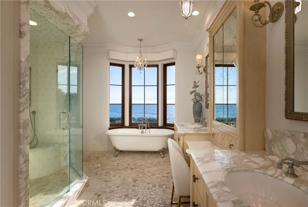 Bathroom, Chandelier, Free Standing Baths, Glass Shower, Interior, Marble Walls, Recessed Lighting, Water