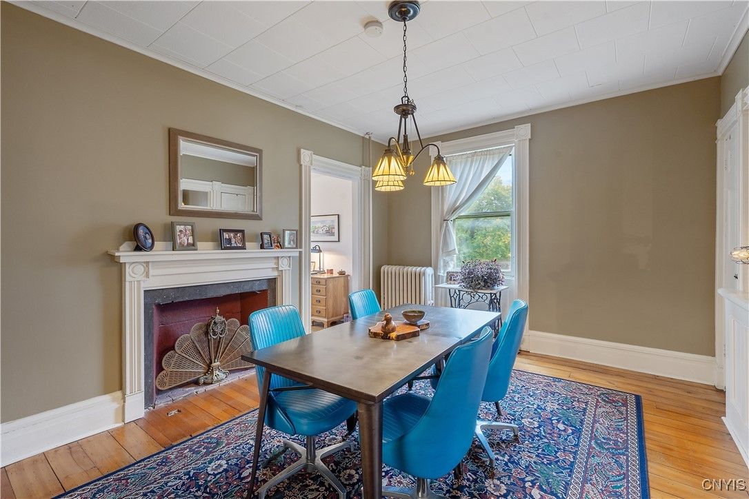 Dining room, Fireplace, Interior, Pendant Lights, Wood Texture Flooring