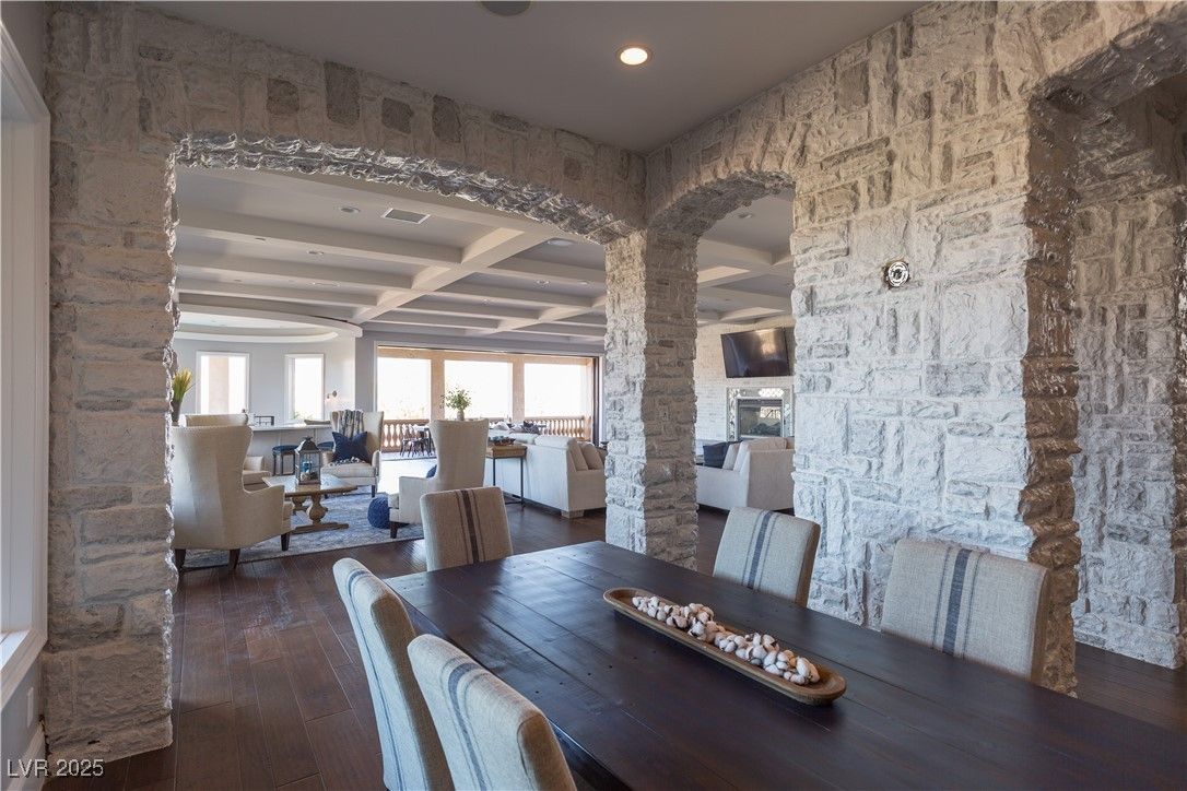 Dining room, Fireplace, Interior, Living room, Recessed Lighting, Stone Walls, Wood Texture Flooring