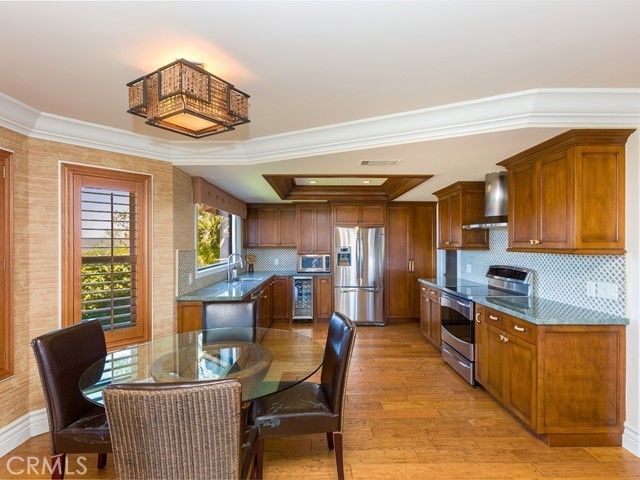 Dining room, Interior, Kitchen, Recessed Lighting, Stainless Steel Appliances, Wood Texture Flooring