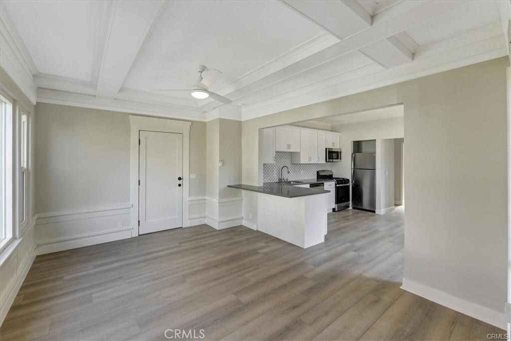 Empty room, Interior, Kitchen, Stainless Steel Appliances, Wood Texture Flooring