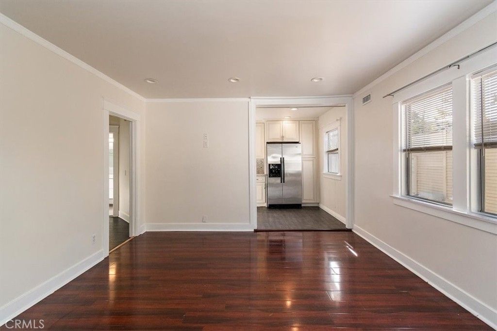 Empty room, Interior, Kitchen, Recessed Lighting, Stainless Steel Appliances, Wood Texture Flooring