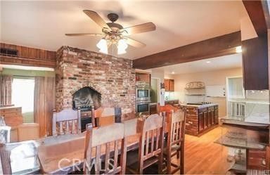 Dining room, Fireplace, Interior, Kitchen, Recessed Lighting, Stone Walls, Wooden Beams, Wood Texture Flooring