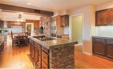 Chandelier, Dining room, Interior, Kitchen, Recessed Lighting, Stainless Steel Appliances, Wooden Beams, Wood Texture Flooring