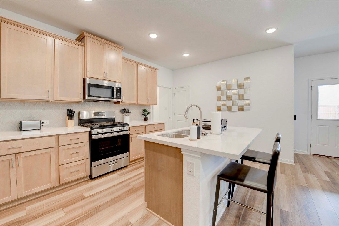 Interior, Kitchen, Recessed Lighting, Stainless Steel Appliances, Wood Texture Flooring