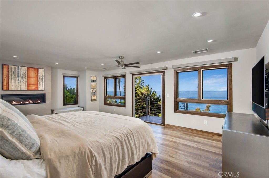 Bedroom, Fireplace, Interior, Recessed Lighting, Water, Wood Texture Flooring