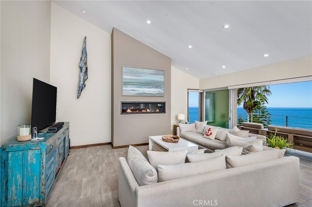 Fireplace, Interior, Living room, Recessed Lighting, Water, Wood Texture Flooring