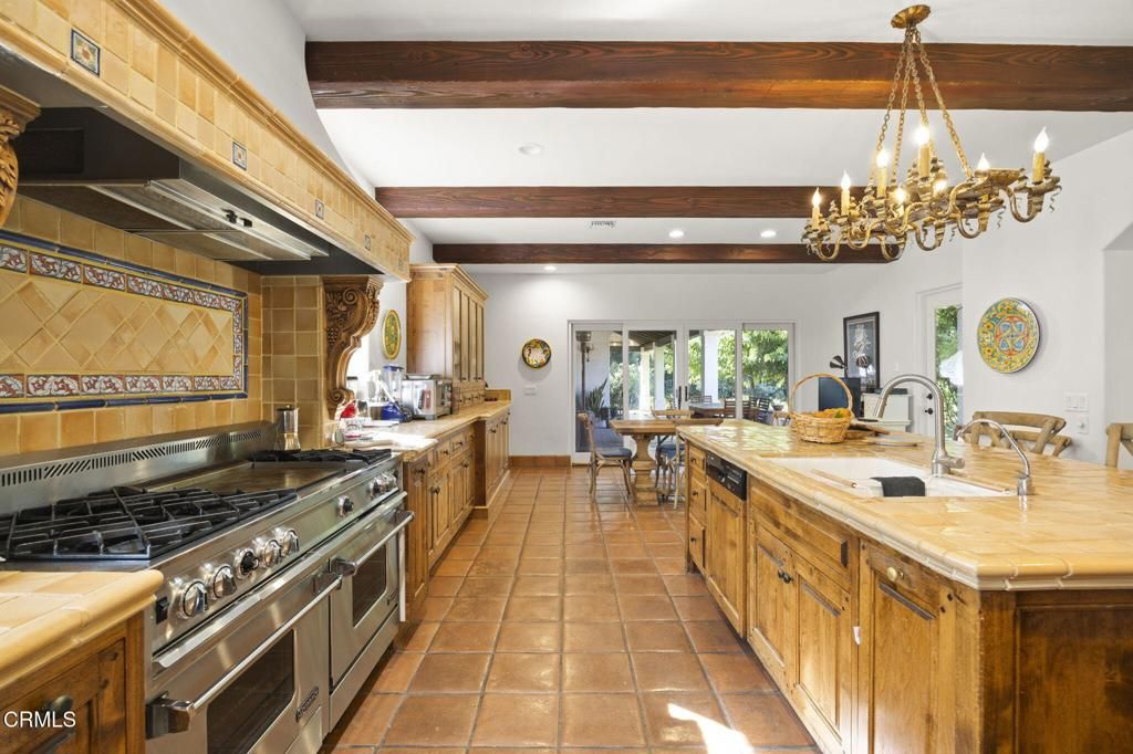 Chandelier, Dining room, Interior, Kitchen, Recessed Lighting, Stainless Steel Appliances, Tile Countertops, Wooden Beams