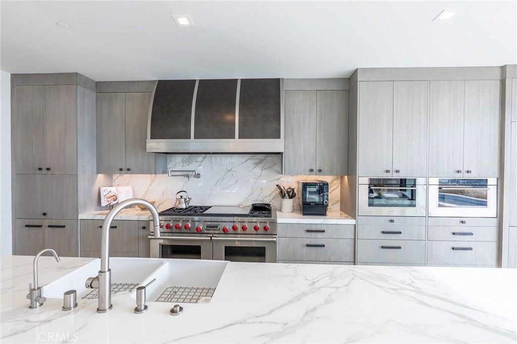 Interior, Kitchen, Marble Walls, Recessed Lighting, Stainless Steel Appliances