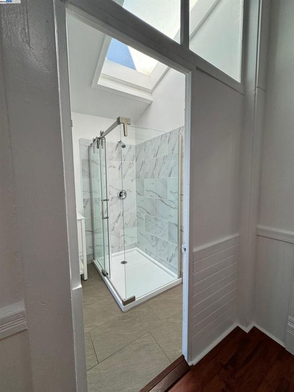 Bathroom, Glass Shower, Interior, Marble Walls, Wood Texture Flooring