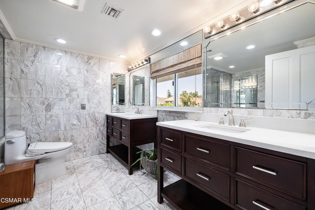 Bathroom, Dual Sink Vanities, Glass Shower, Interior, Marble, Marble Walls, Recessed Lighting