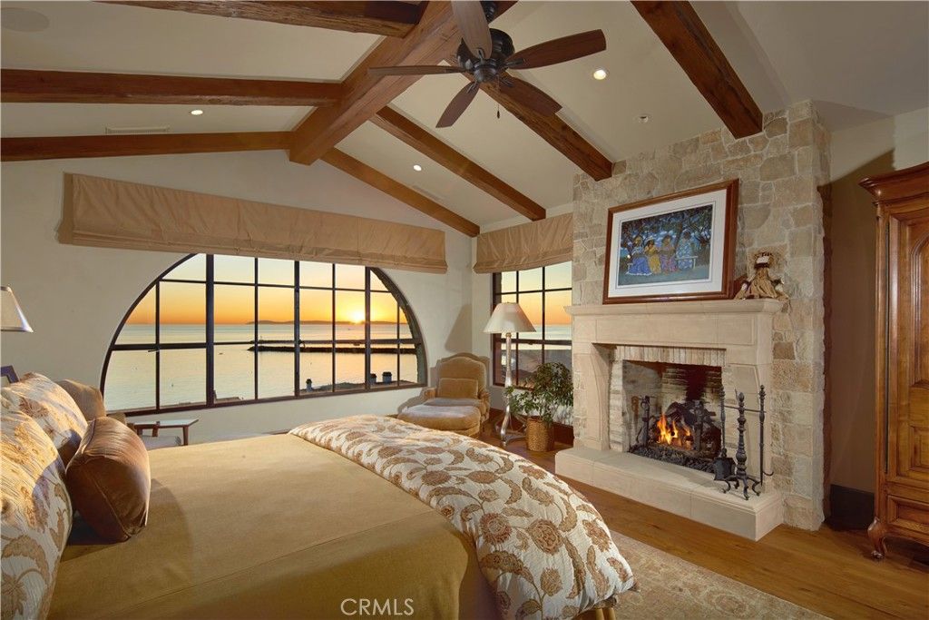 Bedroom, Fireplace, Interior, Recessed Lighting, Stone Walls, Water, Wooden Beams, Wood Texture Flooring